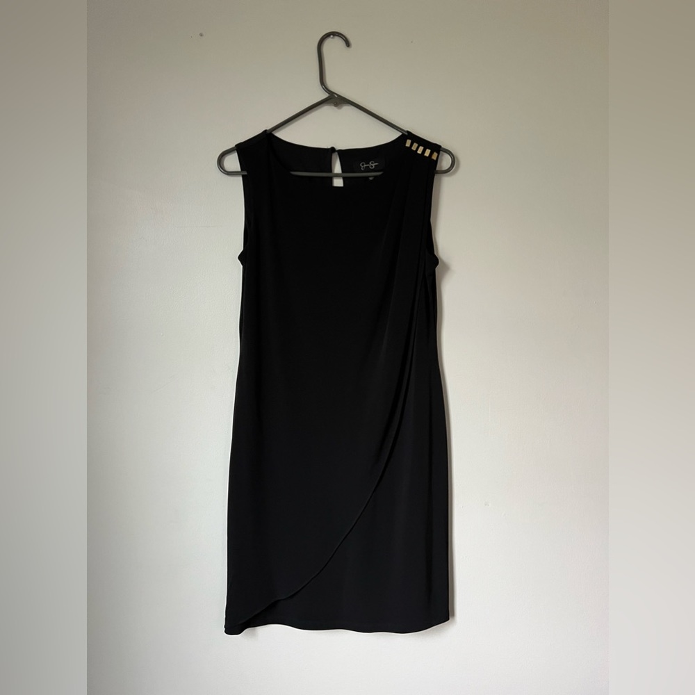 Sleeveless black dress with gold detailing. Size 4